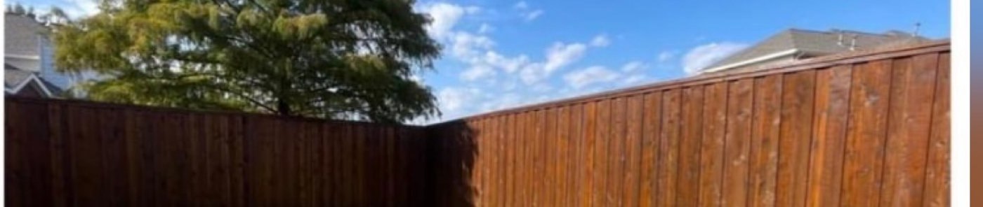 A long privacy fence stained an even walnut