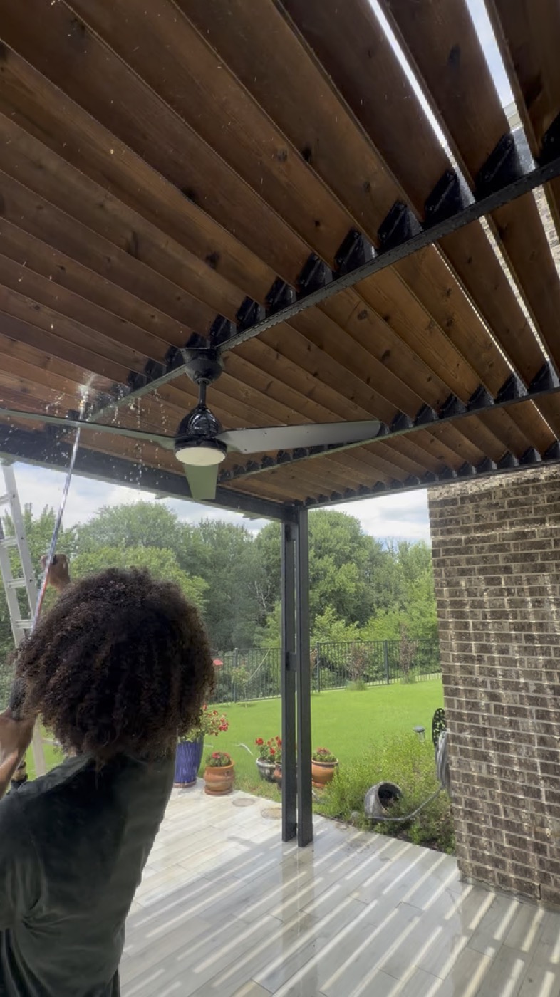 Prime Estate Services staining wood at an upscale home